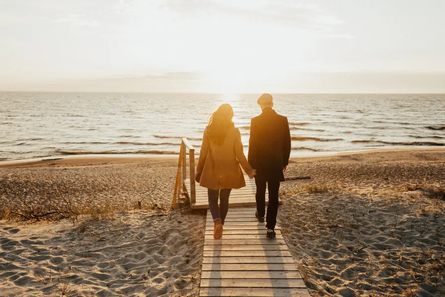 Photo of a couple walking towards the beach as a representative image of the short film - Code of Love